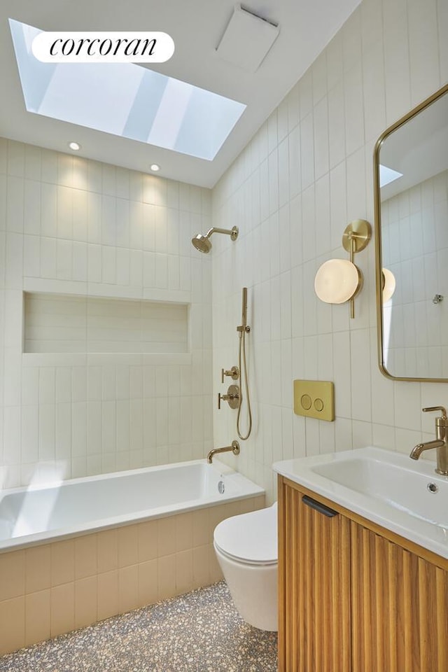 824A Quincy St, New York City, NY 11221 - full bath featuring tile walls, tiled shower / bath combo, a skylight, vanity, and speckled floor