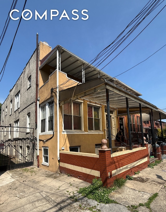 764 Saratoga Ave, New York City, NY 11212 - rear view of property featuring stucco siding