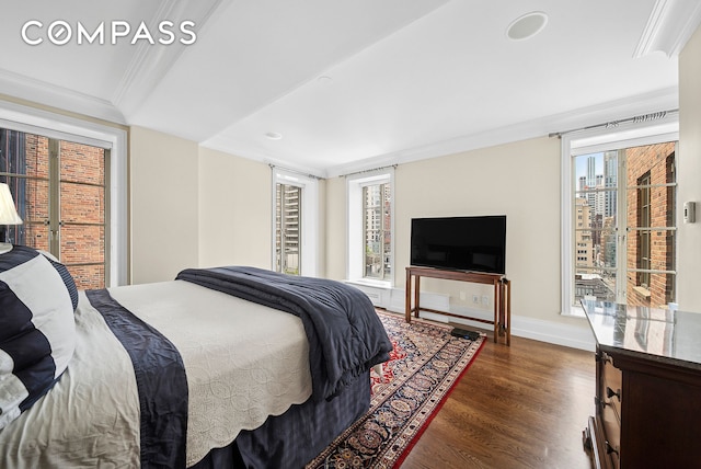 140 E 63rd St Unit 9E, New York City, NY 10065 - bedroom with crown molding, dark wood-style flooring, access to exterior, and recessed lighting