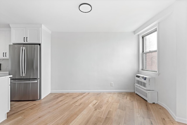 1655 Flatbush Ave Unit B1812, New York City, NY 11210 - kitchen featuring freestanding refrigerator, light wood-style flooring, white cabinetry, and light countertops