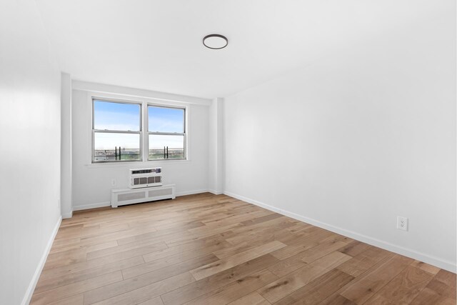 1655 Flatbush Ave Unit B1812, New York City, NY 11210 - unfurnished room with light wood finished floors and radiator heating unit