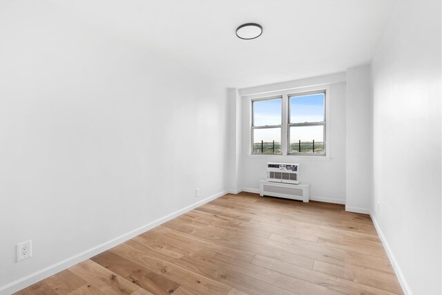 1655 Flatbush Ave Unit B1812, New York City, NY 11210 - unfurnished room with light wood-style floors and a wall unit AC