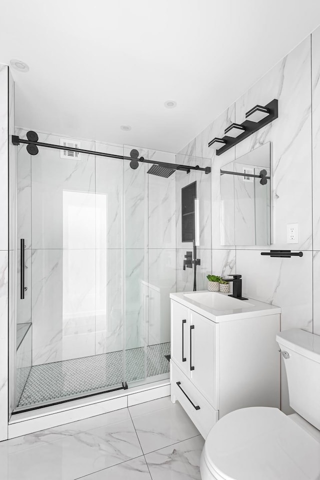 1655 Flatbush Ave Unit B1812, New York City, NY 11210 - full bathroom featuring vanity, marble look tile flooring, a marble finish shower, and tile walls