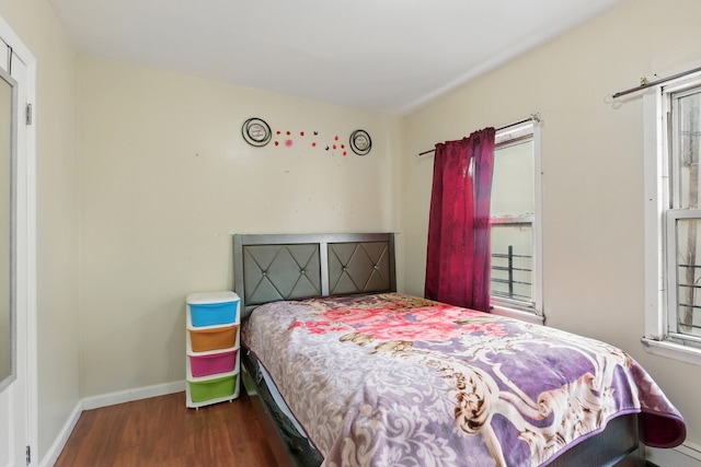 2517 Boston Rd, New York City, NY 10467 - bedroom featuring wood finished floors and multiple windows