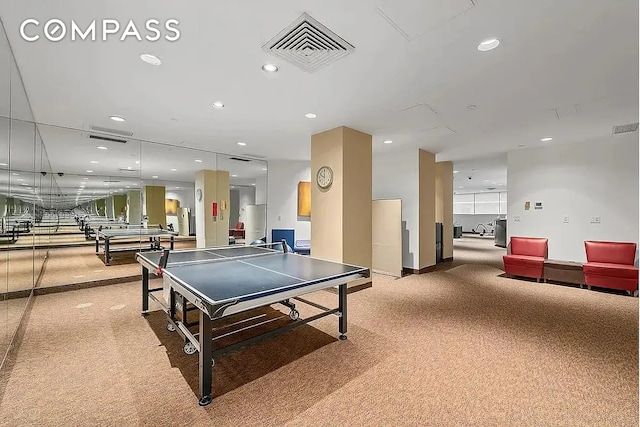 235 E 40th St Unit 11G, New York City, NY 10016 - recreation room with recessed lighting and carpet