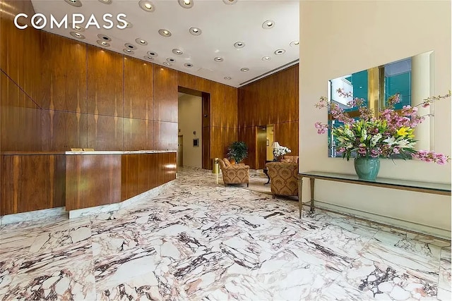235 E 40th St Unit 11G, New York City, NY 10016 - common area featuring wood walls and recessed lighting