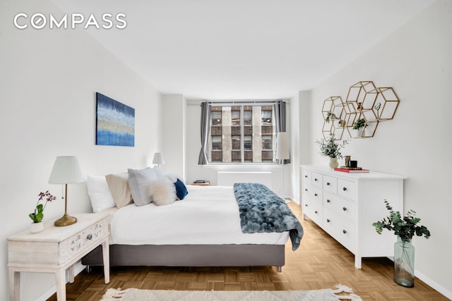 235 E 40th St Unit 11G, New York City, NY 10016 - bedroom featuring baseboards