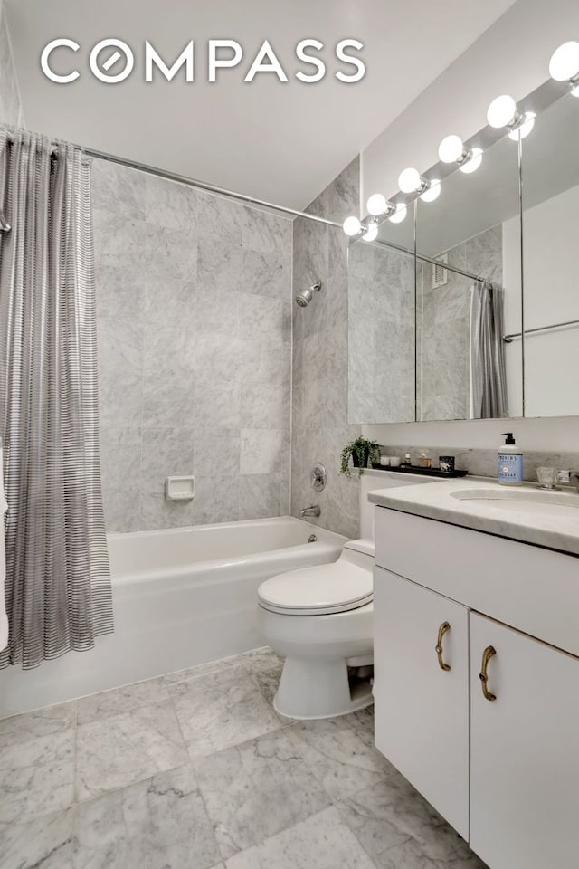 235 E 40th St Unit 11G, New York City, NY 10016 - bathroom featuring shower / bathtub combination with curtain, vanity, and marble finish floors