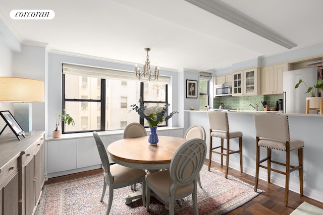 235 E 73rd St Unit 3E, New York City, NY 10021 - dining area with ornamental molding and a chandelier