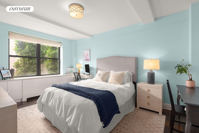 235 E 73rd St Unit 3E, New York City, NY 10021 - bedroom featuring beamed ceiling, an office area, and light wood-type flooring