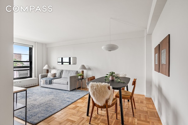 193 Clinton Ave Unit 9D, New York City, NY 11205 - dining room featuring radiator heating unit and baseboards