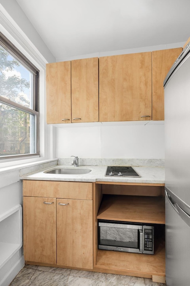 325 W 45th St Unit 312, New York City, NY 10036 - kitchen featuring appliances with stainless steel finishes, light countertops, and light marble finish flooring