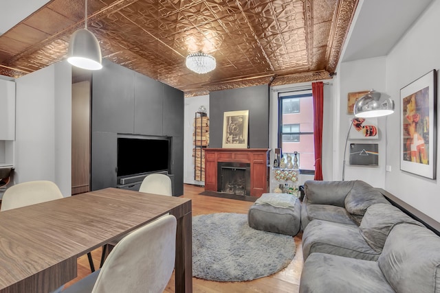 255 W 95th St Unit 4D, New York City, NY 10025 - living area featuring an ornate ceiling, light wood-style floors, and a fireplace