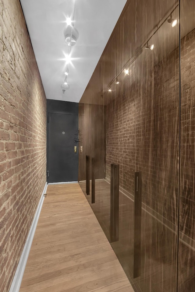 255 W 95th St Unit 4D, New York City, NY 10025 - corridor with brick wall and light wood-type flooring