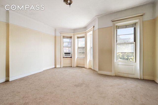 1387 Union St, New York City, NY 11213 - carpeted empty room with plenty of natural light and cooling unit