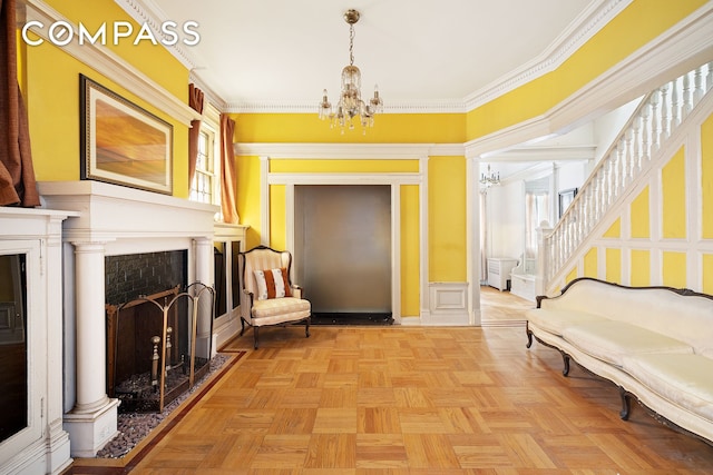 1387 Union St, New York City, NY 11213 - entrance foyer featuring a chandelier, a fireplace, plenty of natural light, ornamental molding, and a wainscoted wall