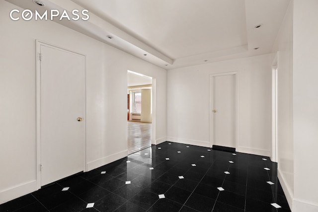 71 Park Ave Unit 12A, New York City, NY 10016 - empty room featuring a raised ceiling and baseboards