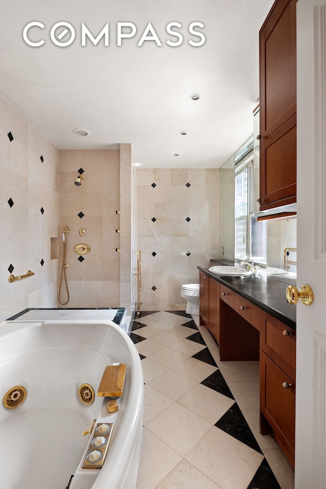 71 Park Ave Unit 12A, New York City, NY 10016 - full bath with tile walls, vanity, a tub with jets, and tiled shower