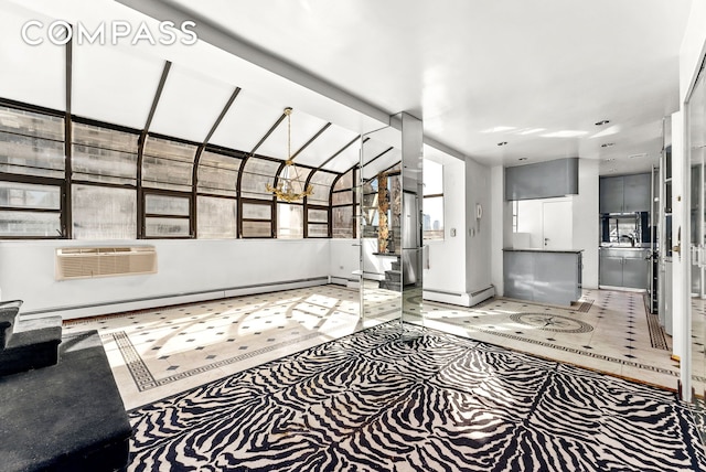40 Sutton Pl Unit 10M, New York City, NY 10022 - unfurnished living room featuring a wall mounted AC, a baseboard radiator, and a chandelier
