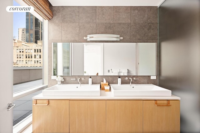 76 Madison Ave Unit Ph1, New York City, NY 10016 - bathroom with double vanity, tile walls, and tasteful backsplash