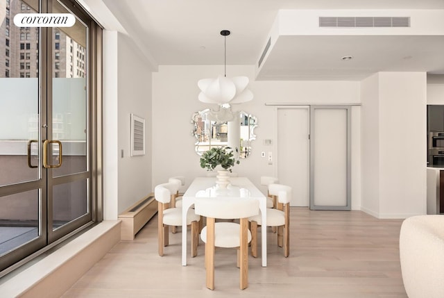 76 Madison Ave Unit Ph1, New York City, NY 10016 - dining space with light wood-type flooring and a chandelier
