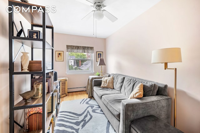 436 78th St Unit 5, New York City, NY 11209 - living area featuring a baseboard heating unit, light wood-style floors, and ceiling fan