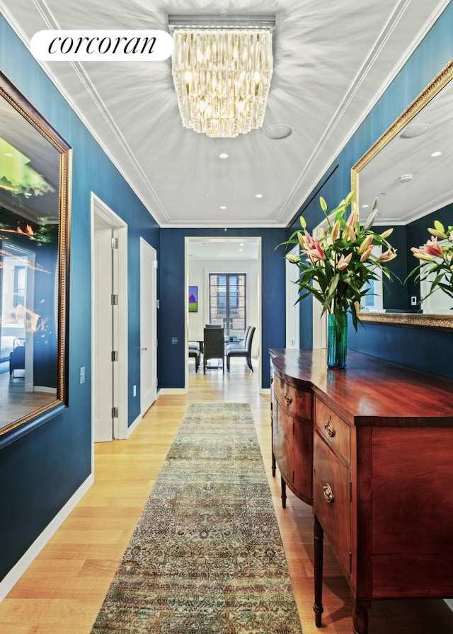 7 Harrison St Unit 4S, New York City, NY 10013 - hall with a chandelier, light wood-style floors, and crown molding