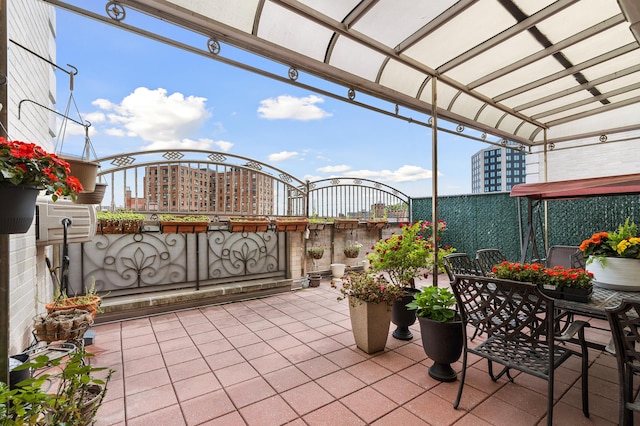 99-31 66th Ave Unit 7-B, New York City, NY 11374 - view of patio with a city view and outdoor dining space