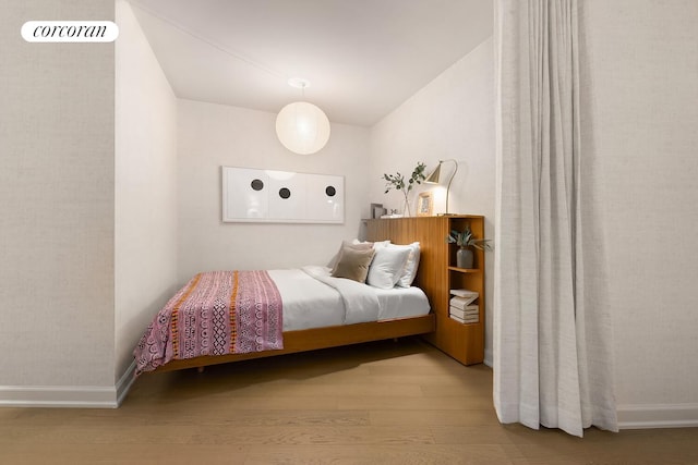 20 River Ter Unit 18Q, New York City, NY 10282 - bedroom featuring wood finished floors and baseboards