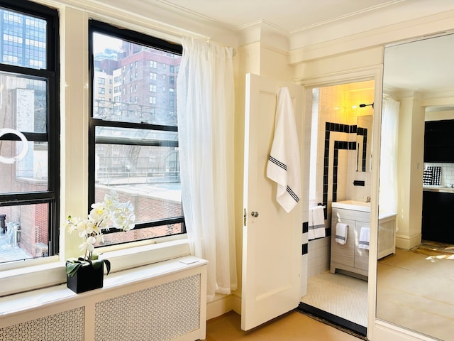 333 E 53rd St Unit 9-N, New York City, NY 10022 - hallway with radiator and ornamental molding