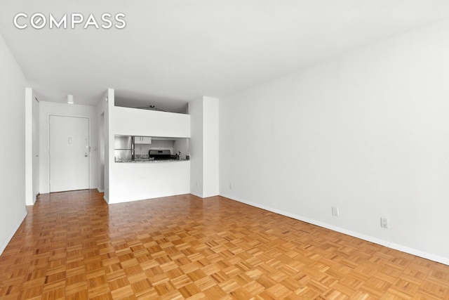 1 Irving Pl Unit U10C, New York City, NY 10003 - unfurnished living room with baseboards