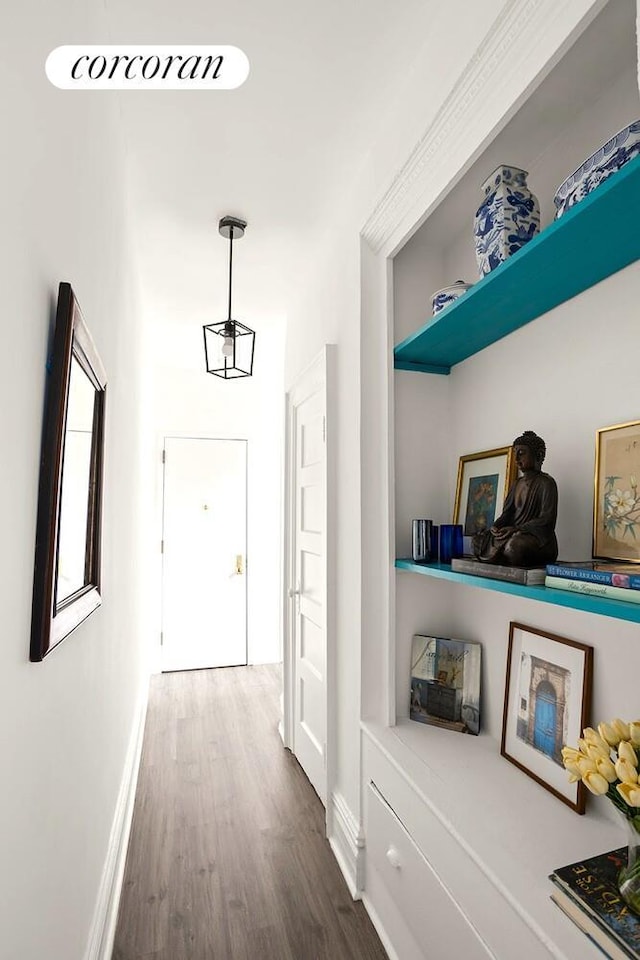 454 15th St Unit 4L, New York City, NY 11215 - hallway featuring dark wood-style flooring and baseboards