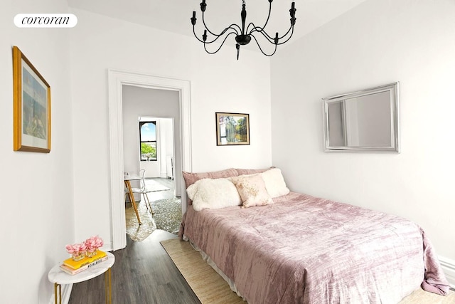 454 15th St Unit 4L, New York City, NY 11215 - bedroom with wood finished floors and a chandelier