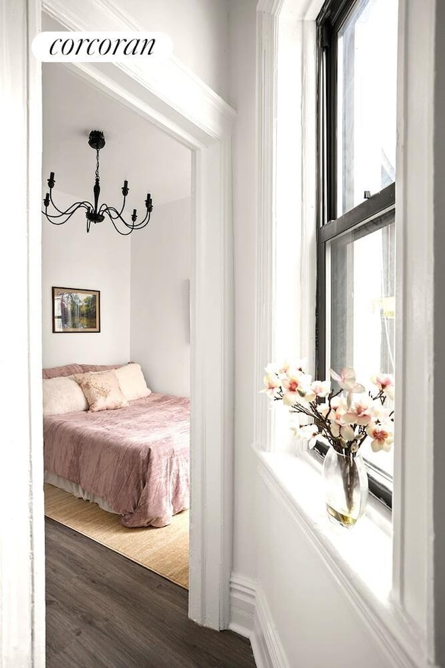 454 15th St Unit 4L, New York City, NY 11215 - bedroom featuring a chandelier and wood finished floors