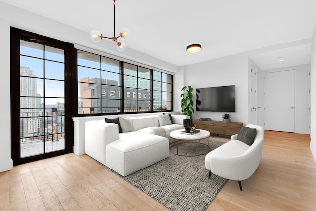 27-21 44th Dr Unit 1601, New York City, NY 11101 - living room with wood finished floors and a chandelier