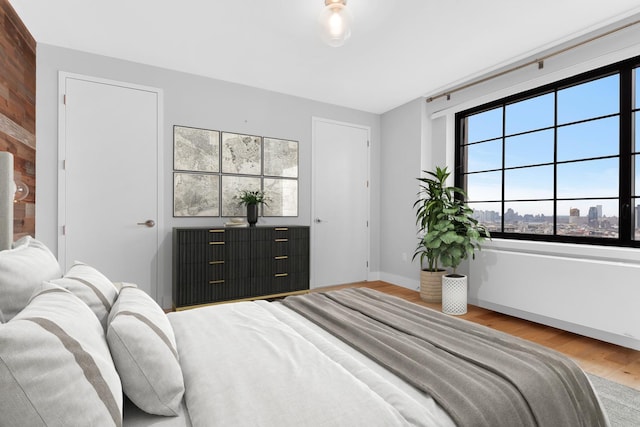 27-21 44th Dr Unit 1601, New York City, NY 11101 - bedroom featuring wood finished floors and baseboards