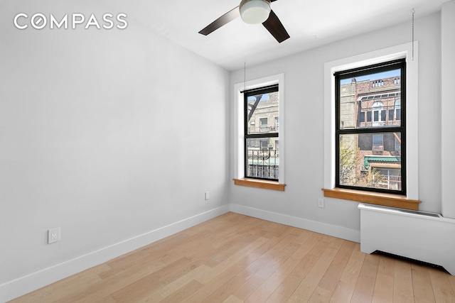 108 Division Ave Unit 22, New York City, NY 11211 - unfurnished room with wood-type flooring, ceiling fan, and radiator