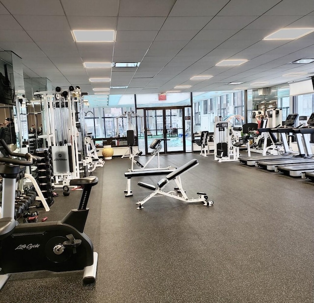 20 W 64th St Unit 11U, New York City, NY 10023 - gym with a paneled ceiling and a wall of windows