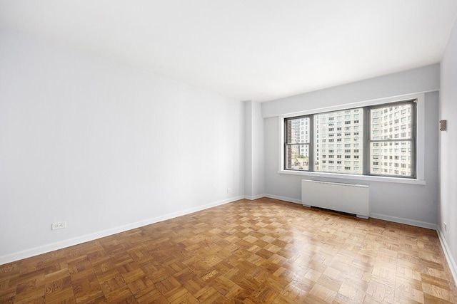 20 W 64th St Unit 11U, New York City, NY 10023 - unfurnished room with radiator and baseboards