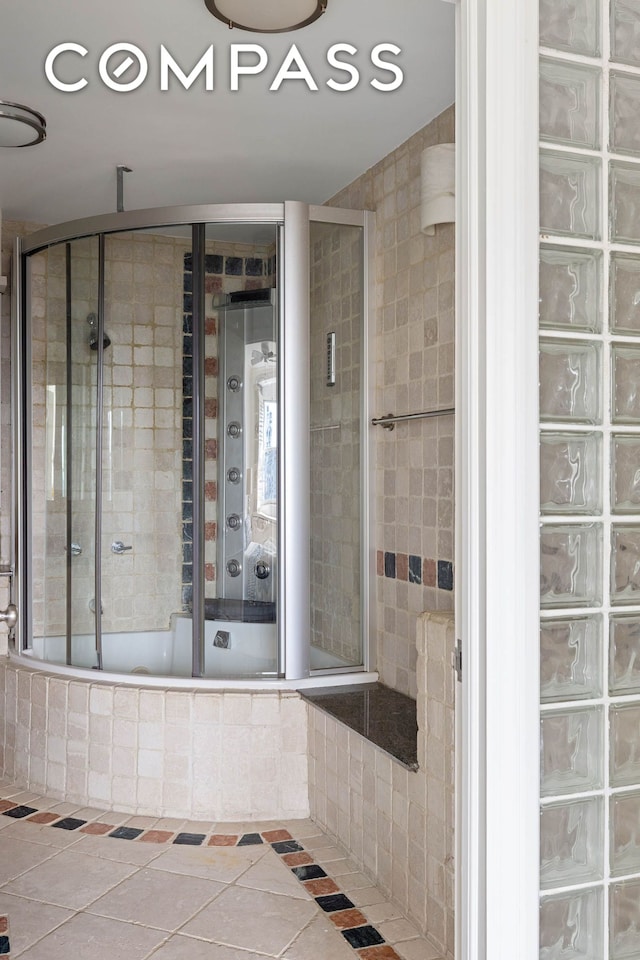 360 W 22nd St Unit 15C, New York City, NY 10011 - full bathroom featuring tiled shower / bath and tile patterned floors