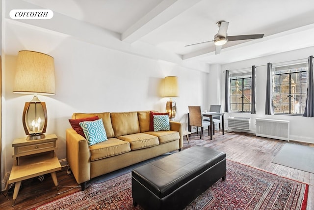 45 Tudor City Pl Unit 1002, New York City, NY 10017 - living area with radiator, beam ceiling, wood finished floors, and a ceiling fan