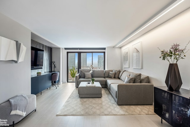 201 W 70th St Unit 24B, New York City, NY 10023 - living room featuring wood finished floors