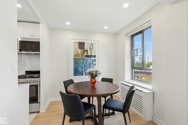 130 8th Ave Unit 6E, New York City, NY 11215 - dining area featuring light wood-type flooring and recessed lighting
