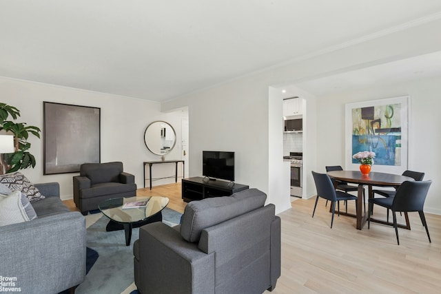130 8th Ave Unit 6E, New York City, NY 11215 - living area with light wood-style flooring and ornamental molding