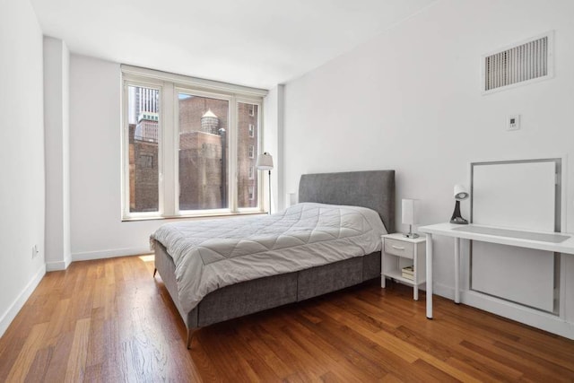 15 William St Unit 9C, New York City, NY 10004 - bedroom with wood finished floors and baseboards