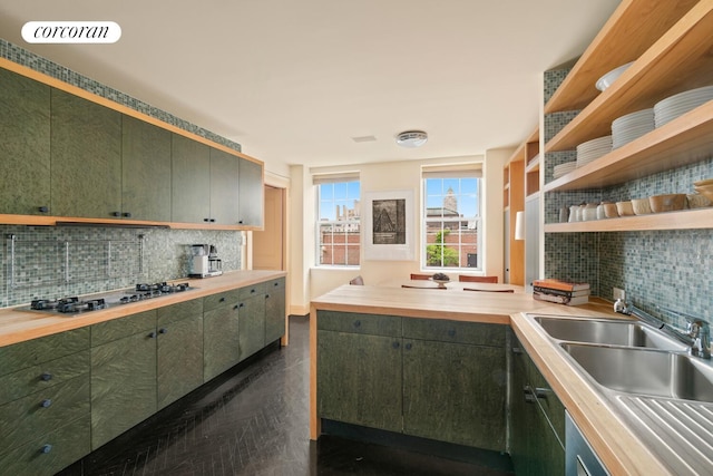 28 E 70th St Unit Ph1, New York City, NY 10021 - kitchen featuring stainless steel gas cooktop, decorative backsplash, open shelves, a peninsula, and green cabinetry