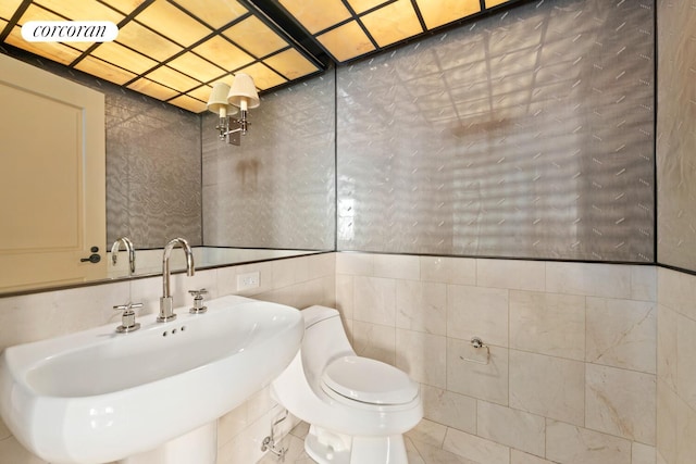 28 E 70th St Unit Ph1, New York City, NY 10021 - half bath featuring a sink and tile walls