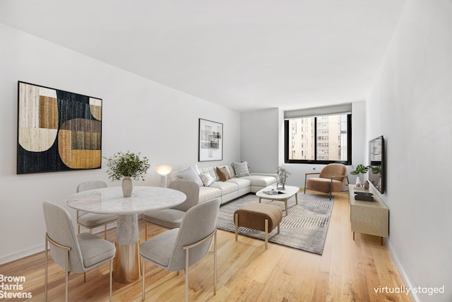 515 E 72nd St Unit 5F, New York City, NY 10021 - living area with light wood-style flooring and baseboards