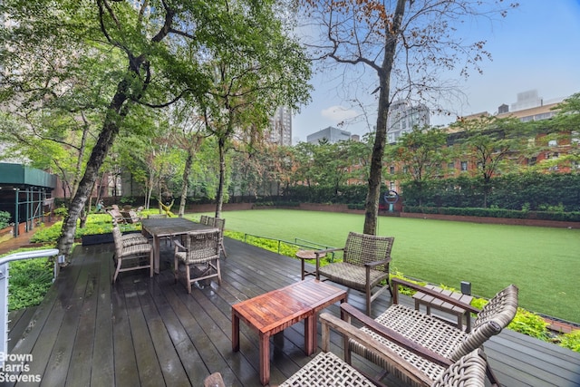 515 E 72nd St Unit 5F, New York City, NY 10021 - wooden terrace with outdoor dining area and a fenced backyard