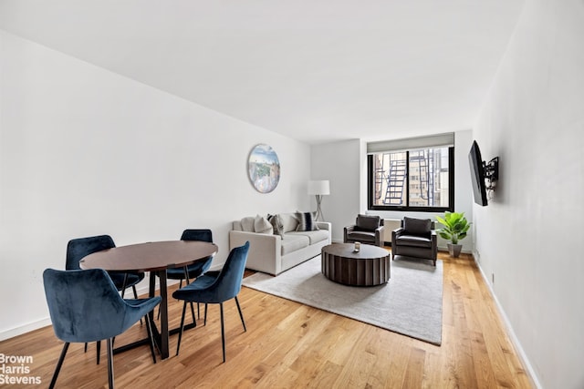 515 E 72nd St Unit 5F, New York City, NY 10021 - living room featuring light wood-style flooring and baseboards